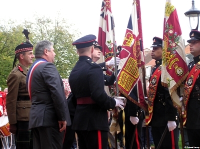 The Mayor is Shown The Battle Honour 'LYS' emblazoned on the Queens Colour