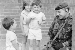 1999 UK NI Street patrol with friendly Locals