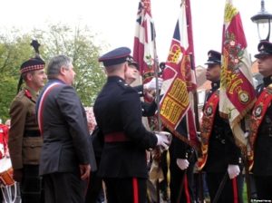 The Mayor is Shown The Battle Honour 'LYS' emblazoned on the Queens Colour